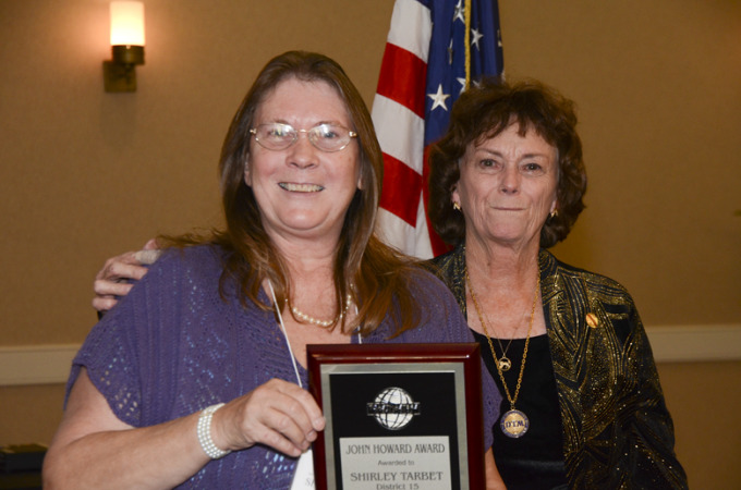 Shirley Tarbet receiving the John Howard Award at the 2011 Fall Conference, Emmy Jones, District Governor presenting
