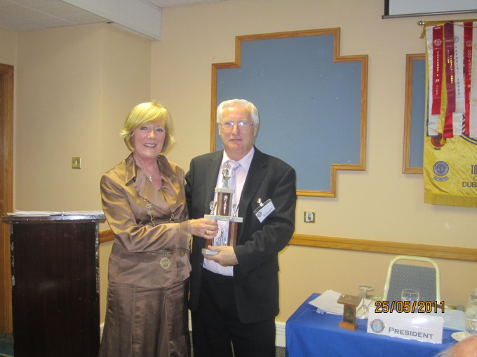 Bobby Power receiving Toastmaster of the year from Dorothy Hickey