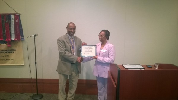 Division G Governor gives a plaque of recognition to the Club