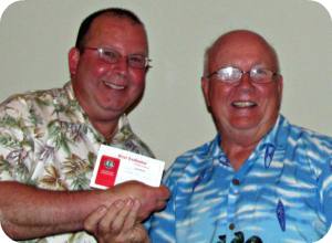 Tony Carlucci receiving best speaker award from Michael Bayne